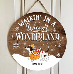 Walkin' In A Wiener Wonderland - Dachshund In Snow - Pale Wooden - Personalized Dog Christmas Door Sign